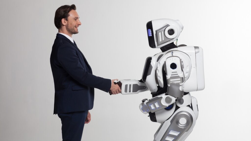 握手するロボットと人間