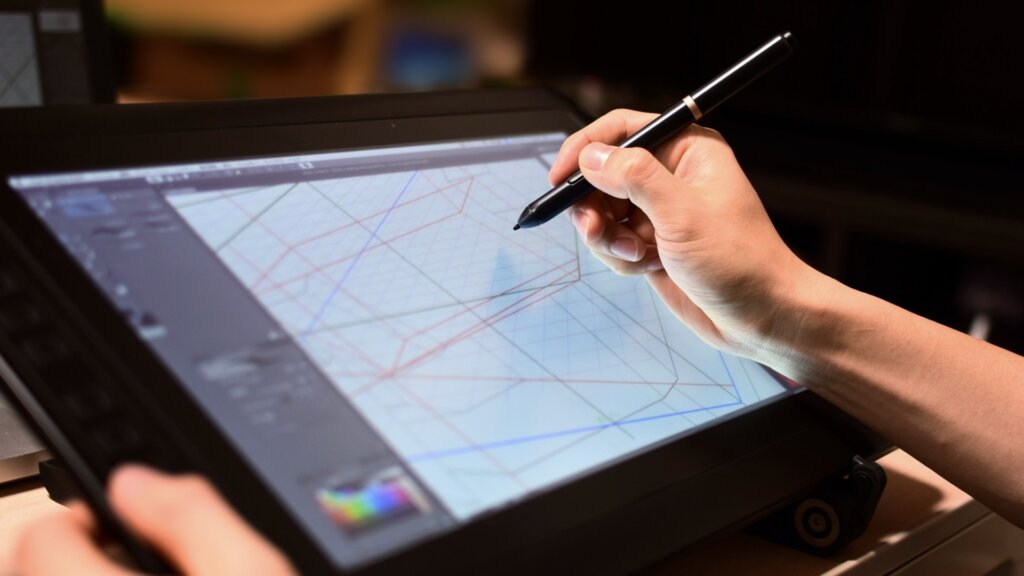 タブレットで絵を描く人